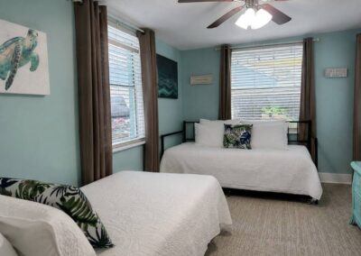 Twin bedroom with two twin beds and trundle at The Salted Dream House.