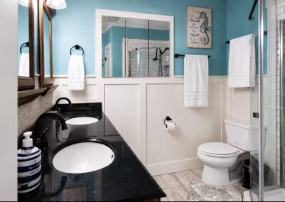 Additional full bathroom with dual sinks at The Salted Dream House.