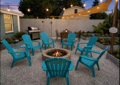 Fire pit seating area in the backyard at The Salted Dream House.
