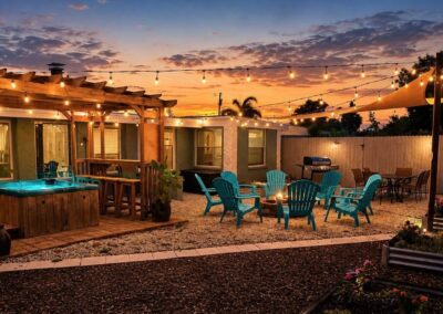 Backyard fire pit and outdoor gathering space at sunset at The Salted Dream House.