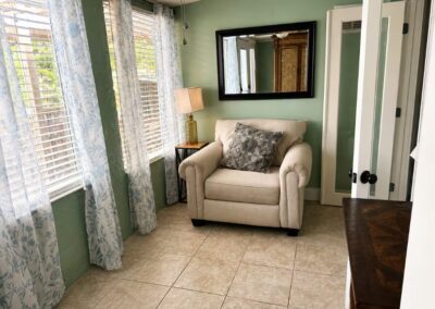 Quiet sunroom with comfortable seating at The Salted Dream House.