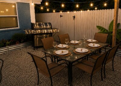 Outdoor dining patio with grill at The Salted Dream House.