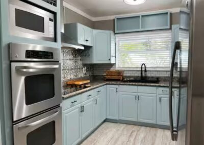 Modern kitchen with stainless steel appliances at The Salted Dream House.