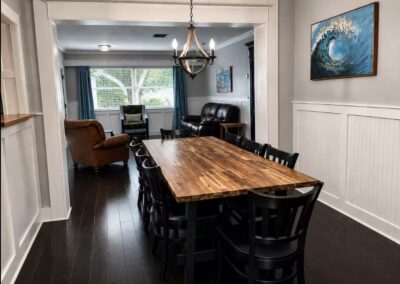 Dining room with large table for family meals at The Salted Dream House.