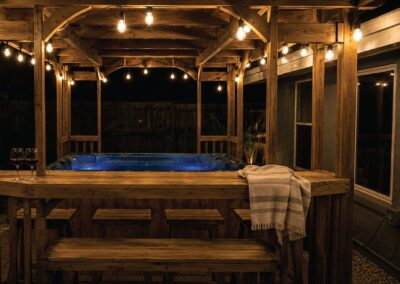 Covered outdoor hot tub at The Salted Dream House vacation rental.
